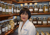 Doctor Cao in the Herbal Pharmay at the East West College of Natural Medicine.